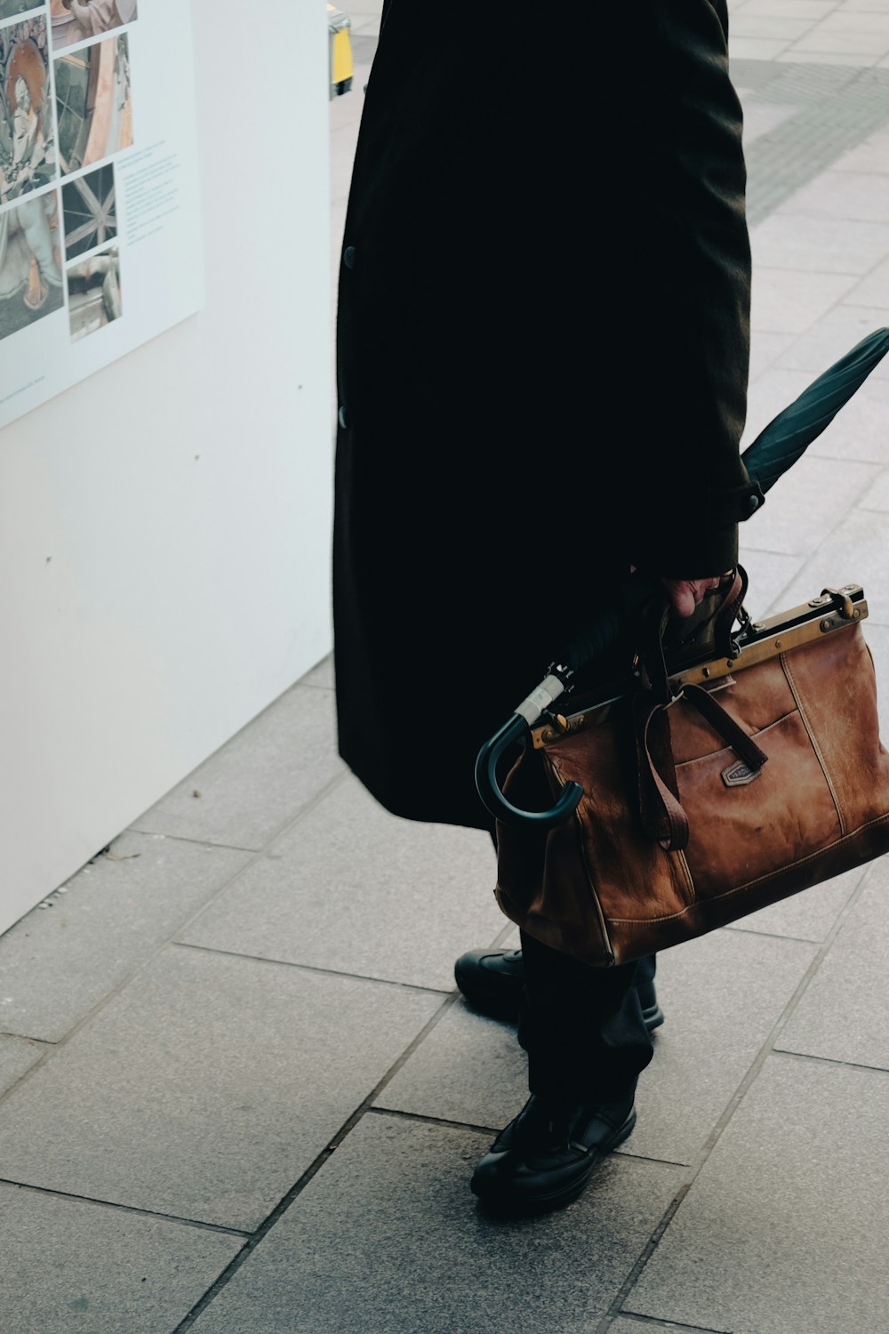 Person carrying brown bag — editorial reference photo
