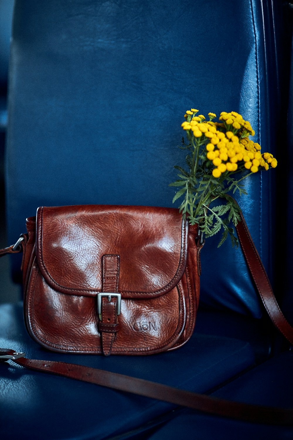 Leather handbag with flower — sample listing photo, not verified inventory